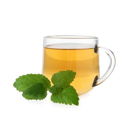 Photo of Aromatic lemon balm tea in glass cup and fresh leaves isolated on white