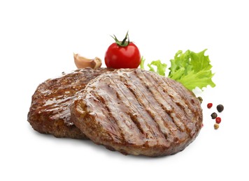 Photo of Delicious hamburger patties, tomato and spices isolated on white