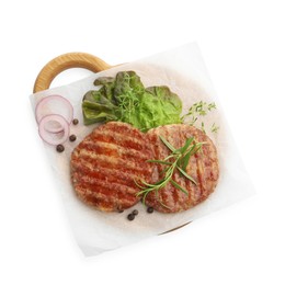 Photo of Delicious hamburger patties and spices isolated on white, top view