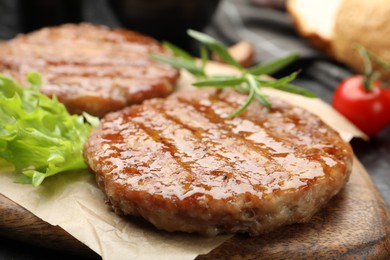 Photo of Delicious hamburger patties and spices on table, closeup