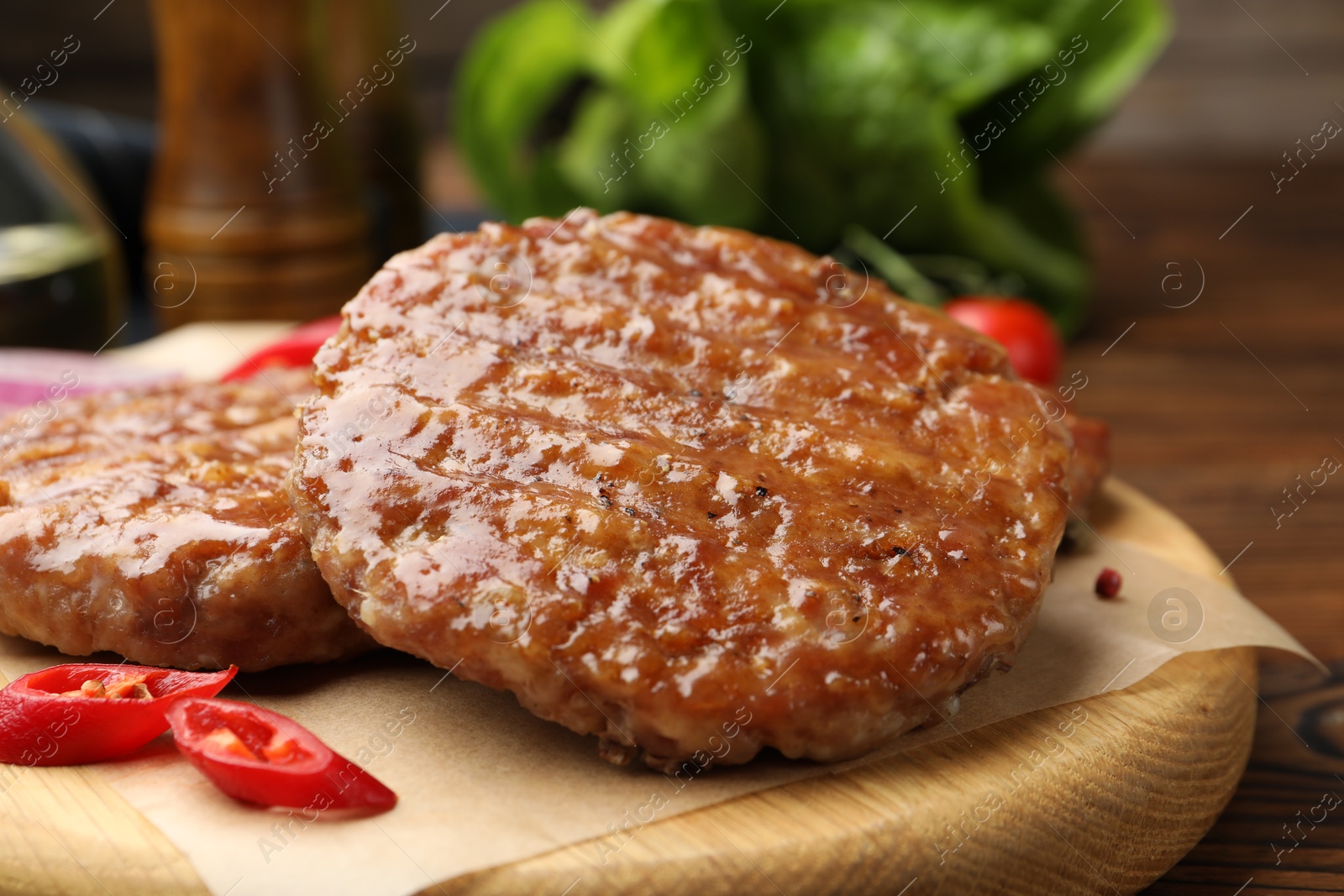 Delicious hamburger patties and spices on table, closeup Photo of Delicious hamburger patties and spices on table, closeup