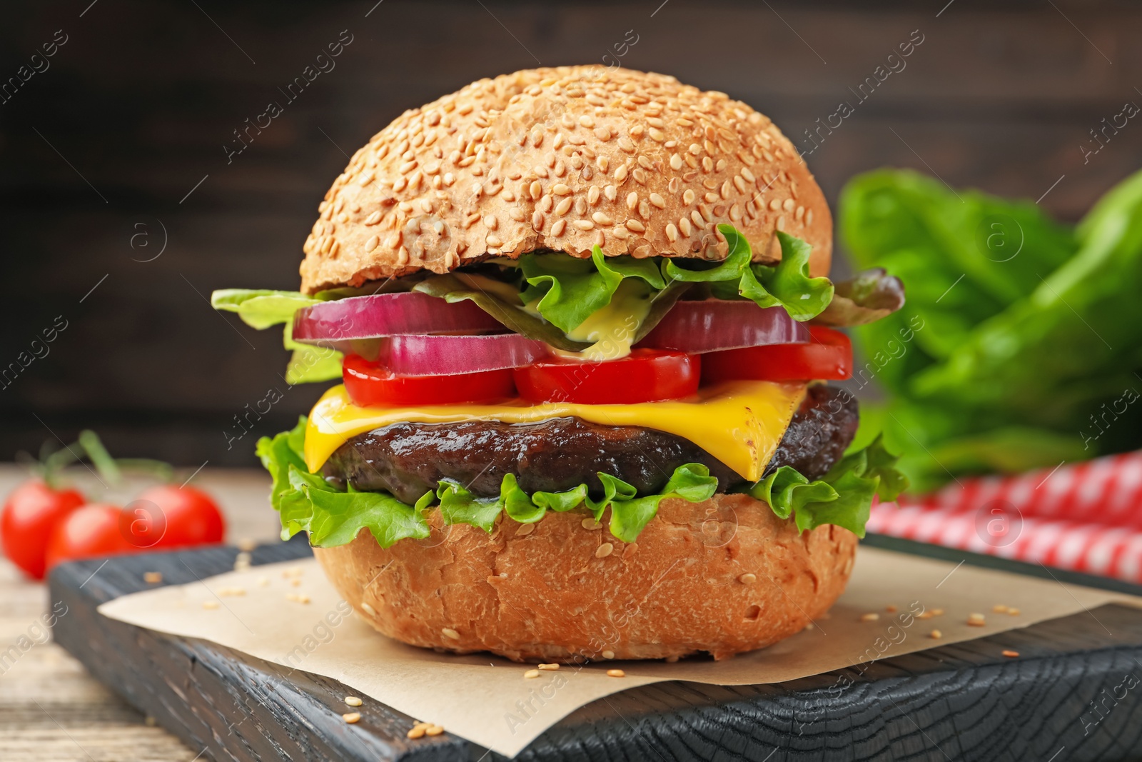 Delicious hamburger with patty and cheese on table, closeup Photo of Delicious hamburger with patty and cheese on table, closeup