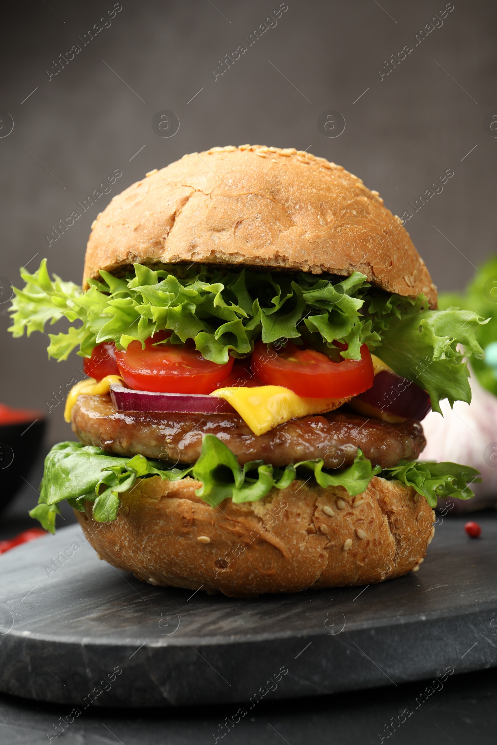 Delicious hamburger with patty served on black table, closeup Photo of Delicious hamburger with patty served on black table, closeup