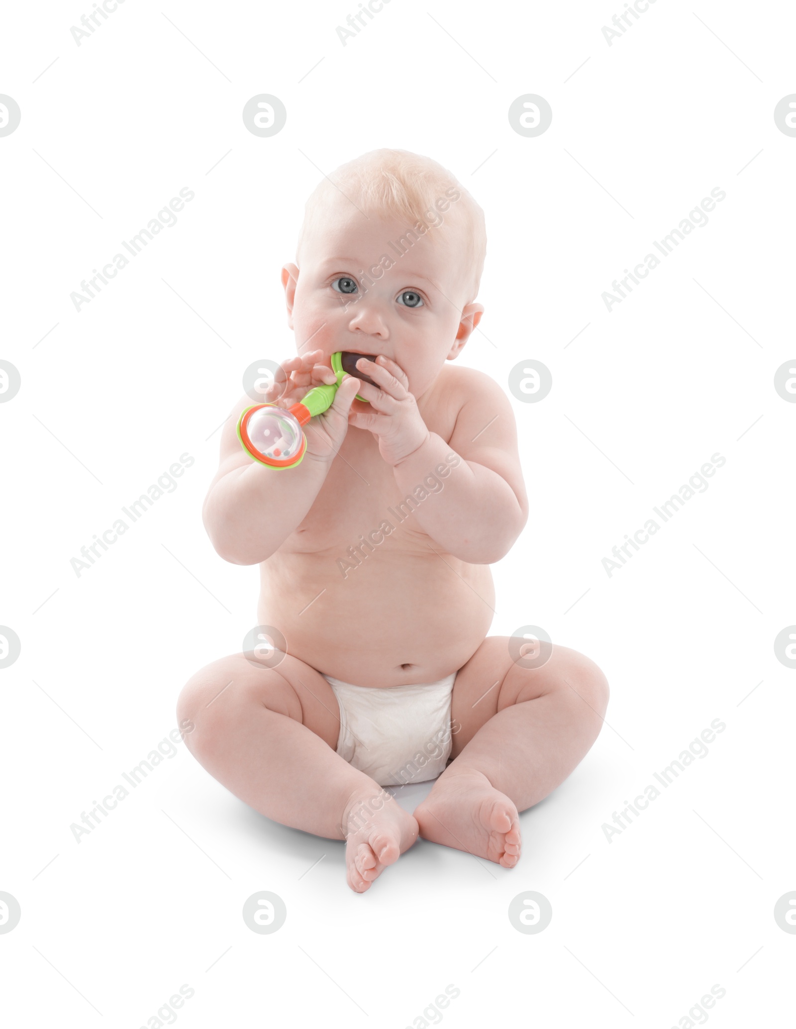 Cute little baby with rattle on white background Photo of Cute little baby with rattle on white background
