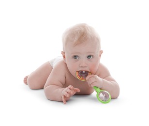 Photo of Cute little baby with rattle on white background
