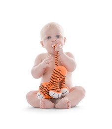 Photo of Cute little baby with knitted toy tiger on white background