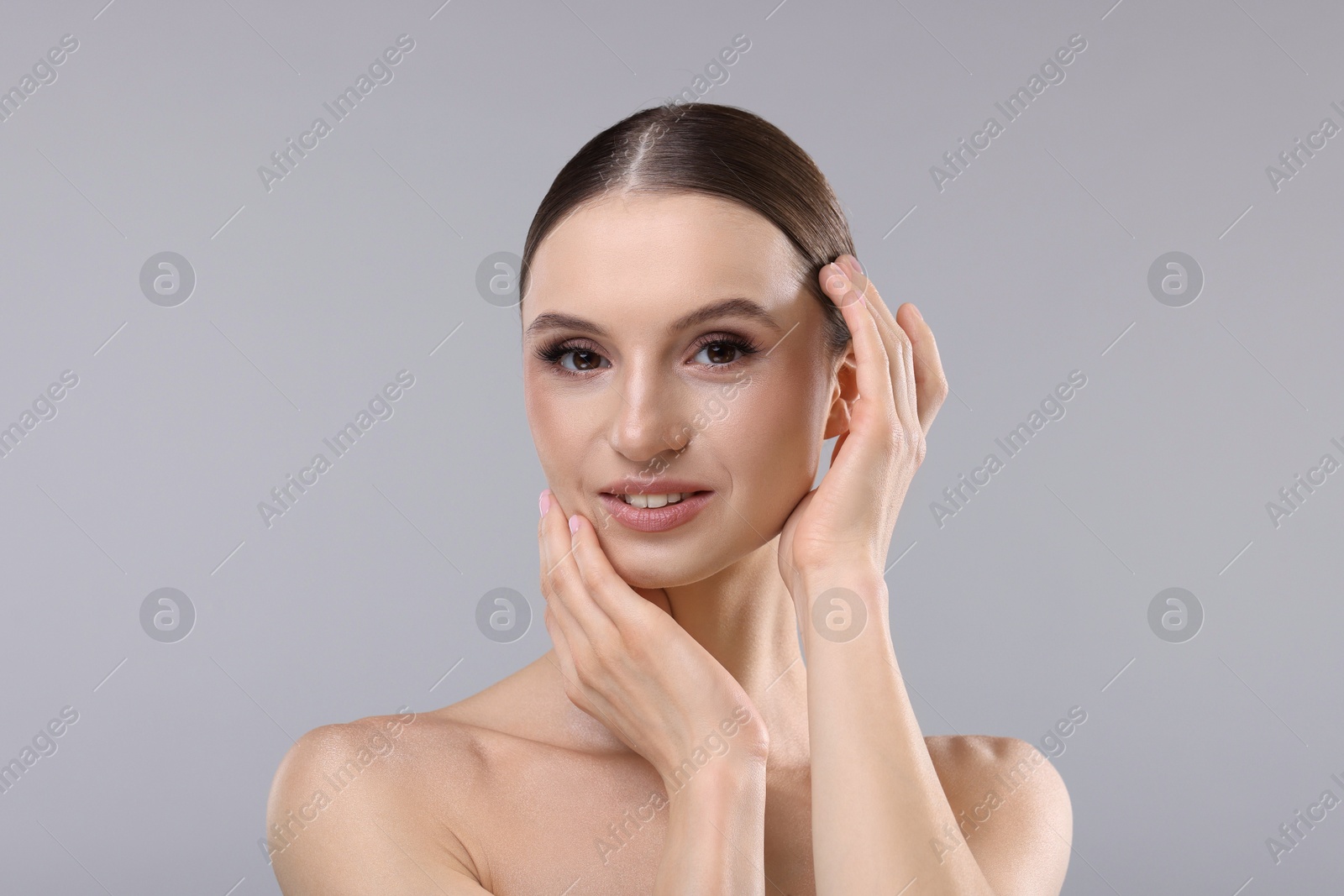 Photo of Portrait of beautiful young woman on gray background