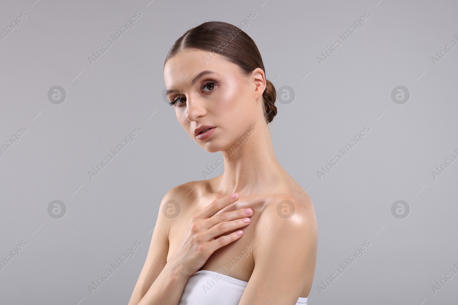 Photo of Portrait of beautiful young woman on gray background
