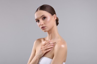 Photo of Portrait of beautiful young woman on gray background