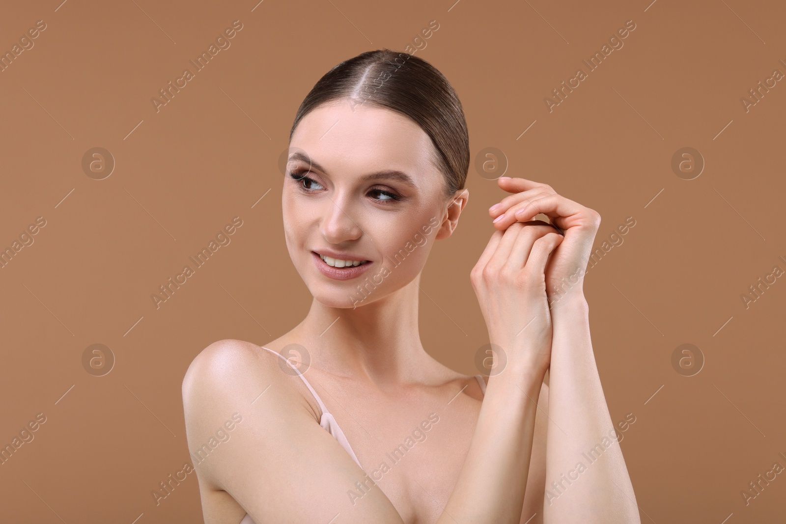 Portrait of beautiful young woman on beige background Photo of Portrait of beautiful young woman on beige background