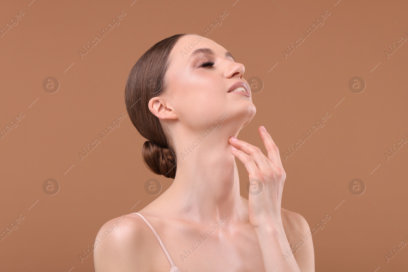 Portrait of beautiful young woman on beige background Photo of Portrait of beautiful young woman on beige background