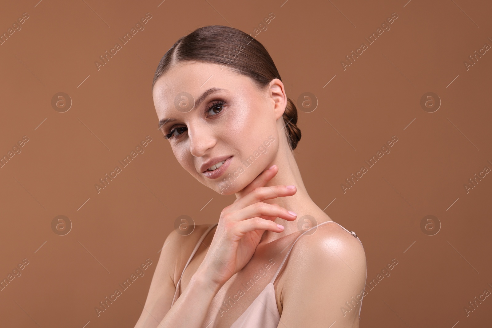 Portrait of beautiful young woman on beige background Photo of Portrait of beautiful young woman on beige background