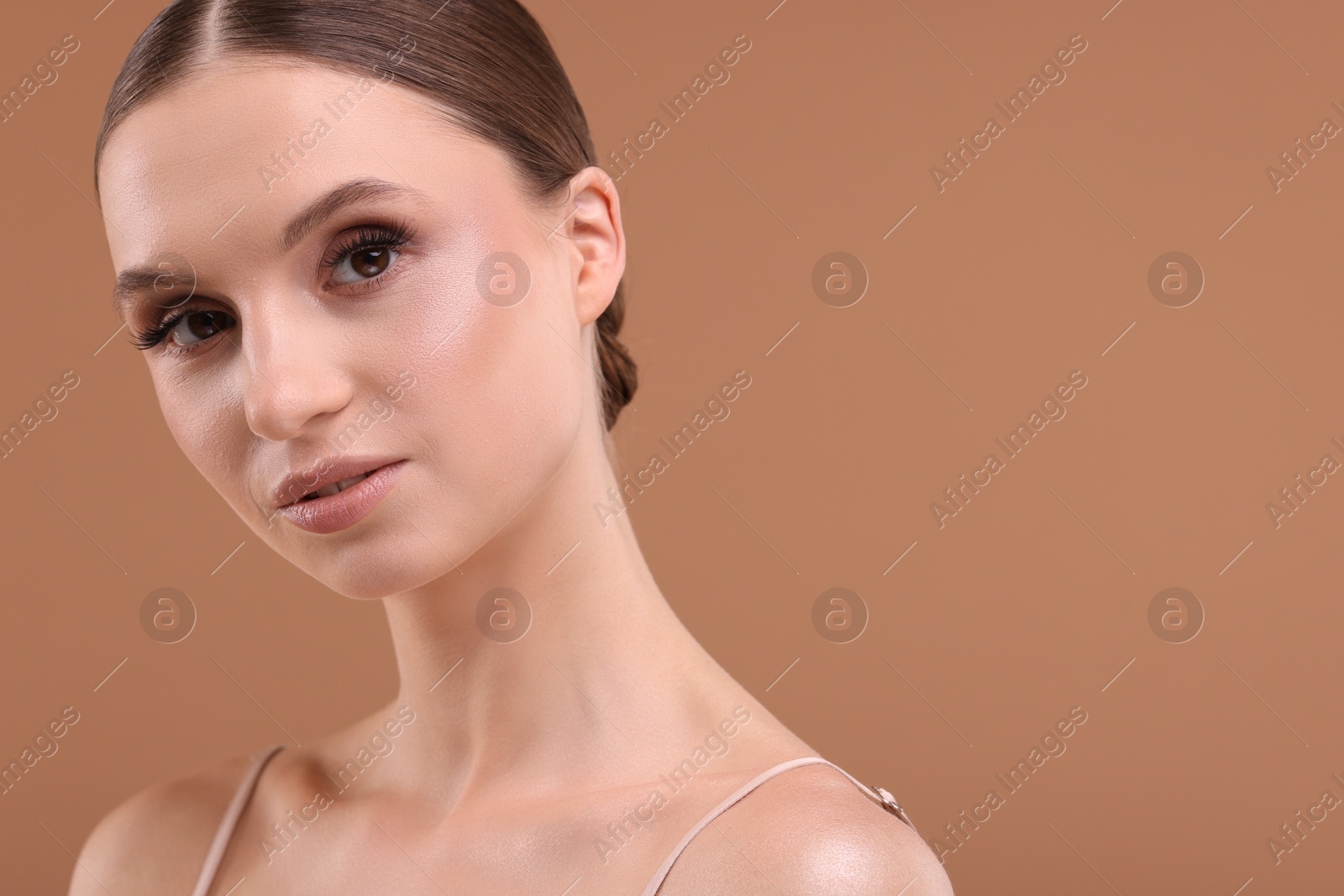 Portrait of beautiful young woman on beige background, closeup. Space for text Photo of Portrait of beautiful young woman on beige background, closeup. Space for text
