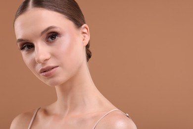 Photo of Portrait of beautiful young woman on beige background, closeup. Space for text