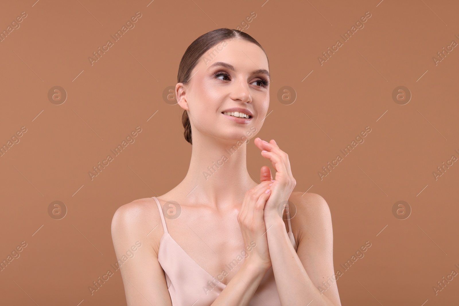 Portrait of beautiful young woman on beige background Photo of Portrait of beautiful young woman on beige background