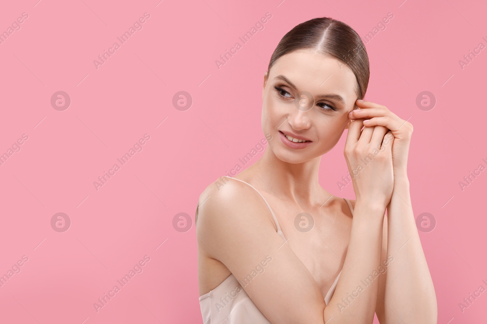 Portrait of beautiful young woman on pink background, space for text Photo of Portrait of beautiful young woman on pink background, space for text