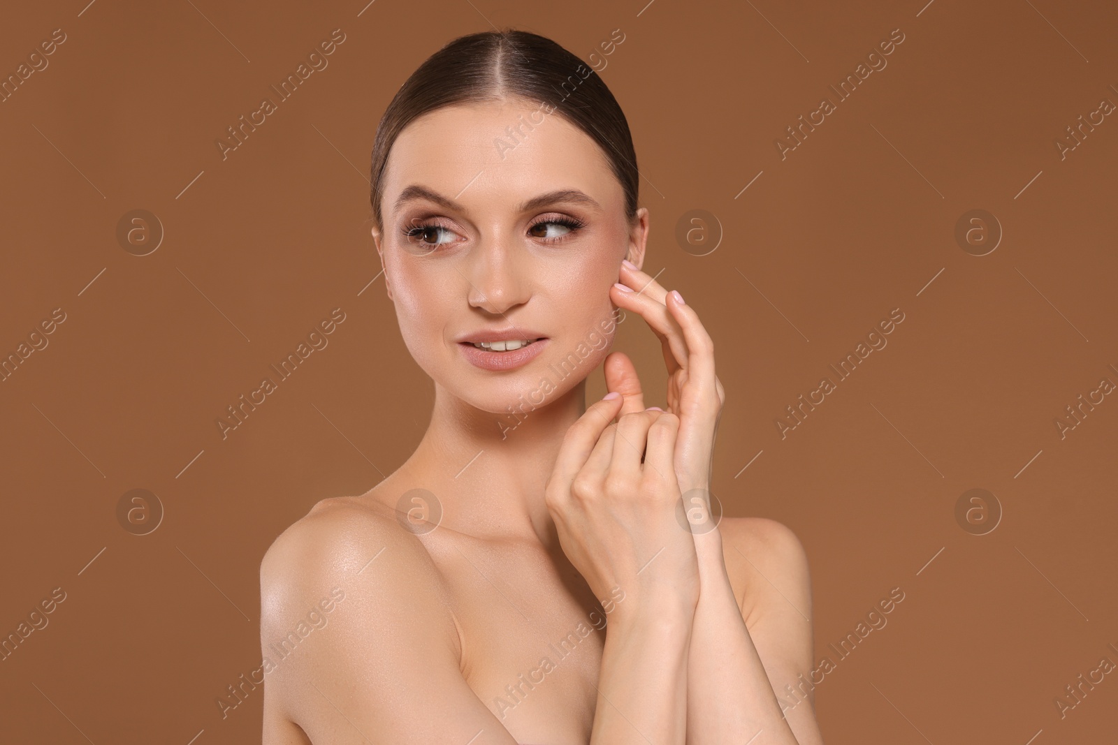 Portrait of beautiful young woman on beige background Photo of Portrait of beautiful young woman on beige background