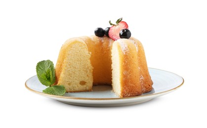 Photo of Tasty bundt cake with powdered sugar, berries and mint isolated on white