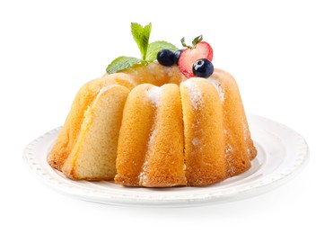 Photo of Tasty bundt cake with powdered sugar, berries and mint isolated on white