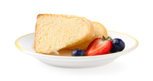 Photo of Pieces of tasty bundt cake with berries isolated on white