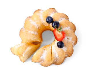 Photo of Tasty bundt cake with powdered sugar and berries isolated on white, top view