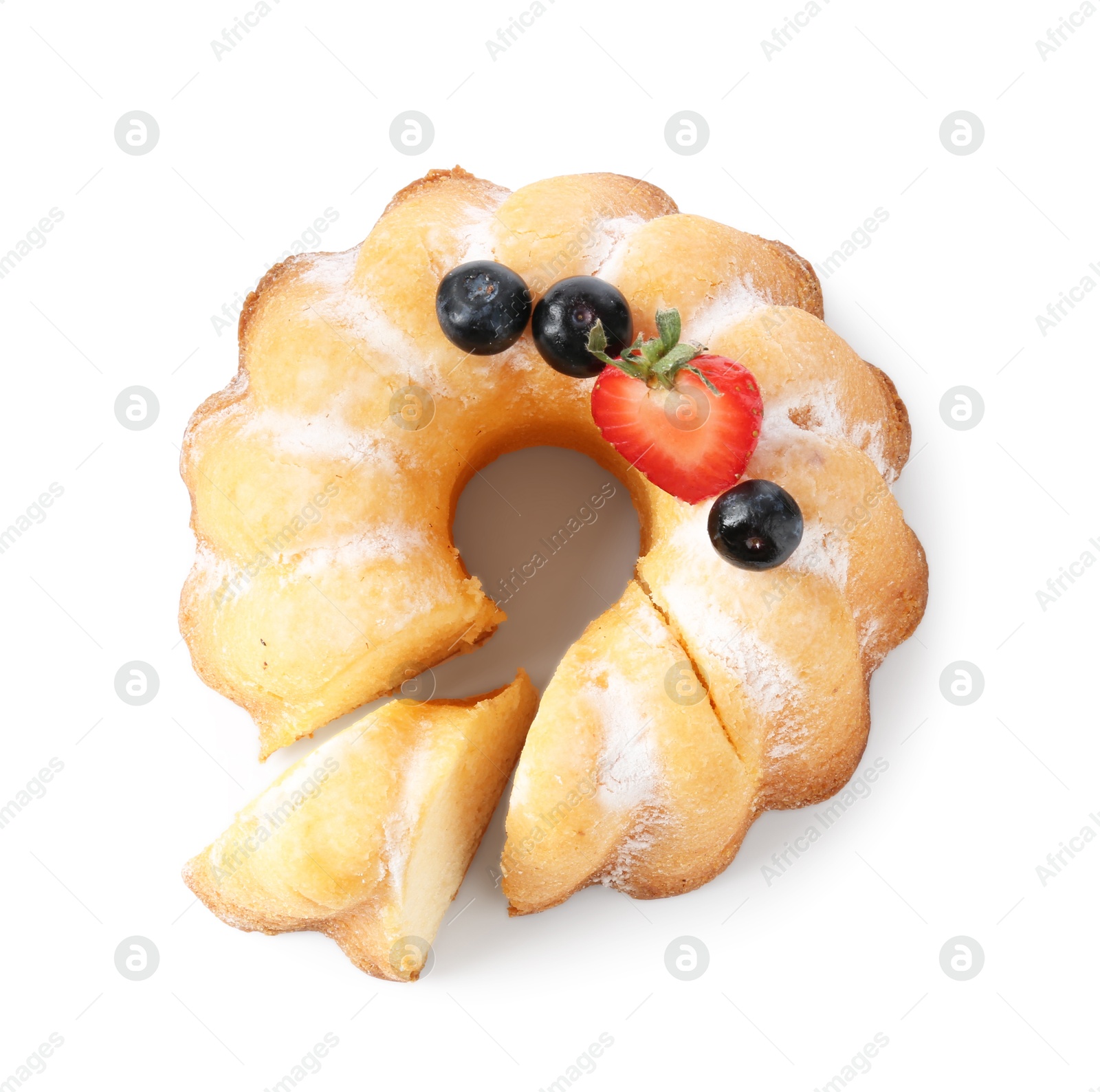 Tasty bundt cake with powdered sugar and berries isolated on white, top view Photo of Tasty bundt cake with powdered sugar and berries isolated on white, top view