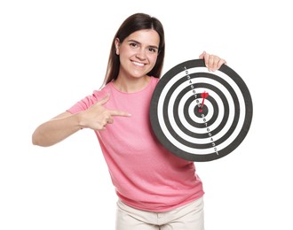 Photo of Targeting. Smiling woman pointing at dart board with arrow on white background