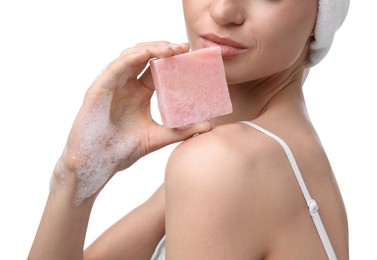 Photo of Woman with soap bar on white background, closeup