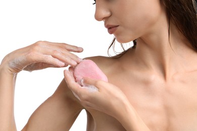 Photo of Woman washing body with soap bar on white background, closeup