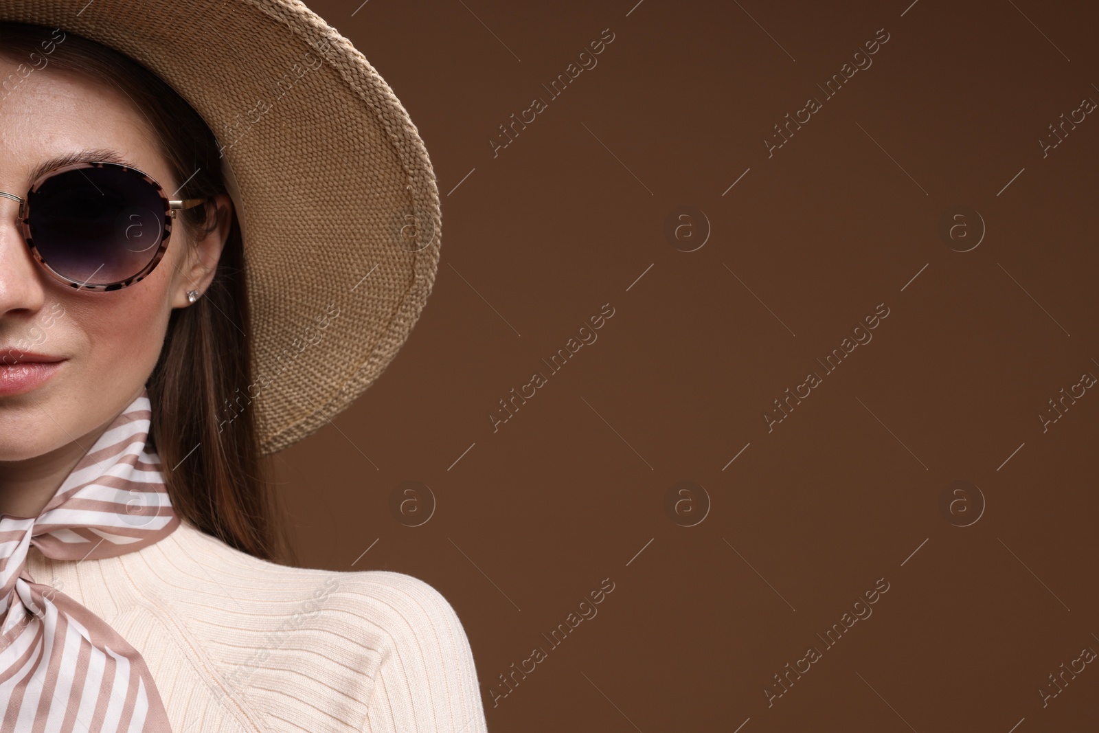 Woman in stylish outfit on brown background, closeup. Space for text Photo of Woman in stylish outfit on brown background, closeup. Space for text
