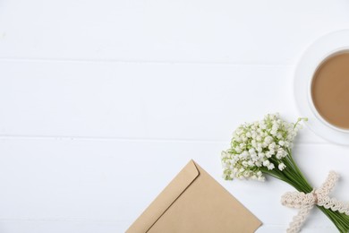 Photo of Bouquet of beautiful lily-of-the-valley flowers, coffee and envelope on white wooden background, flat lay. Space for text