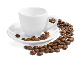 Photo of Ceramic cup with roasted coffee beans isolated on white