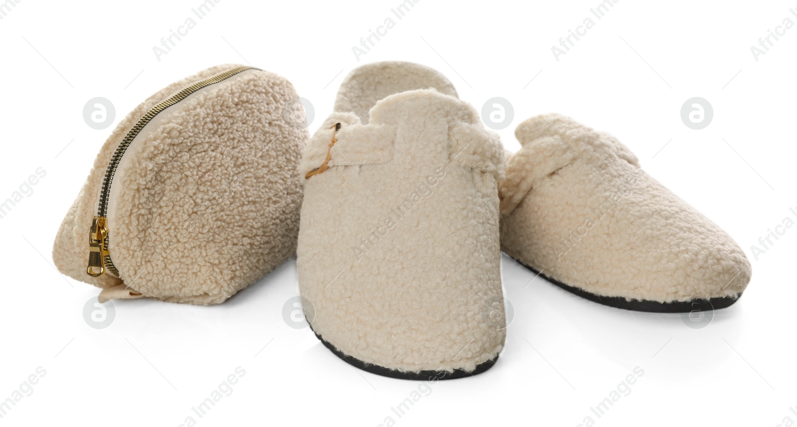 Stylish slippers and cosmetic bag isolated on white Photo of Stylish slippers and cosmetic bag isolated on white