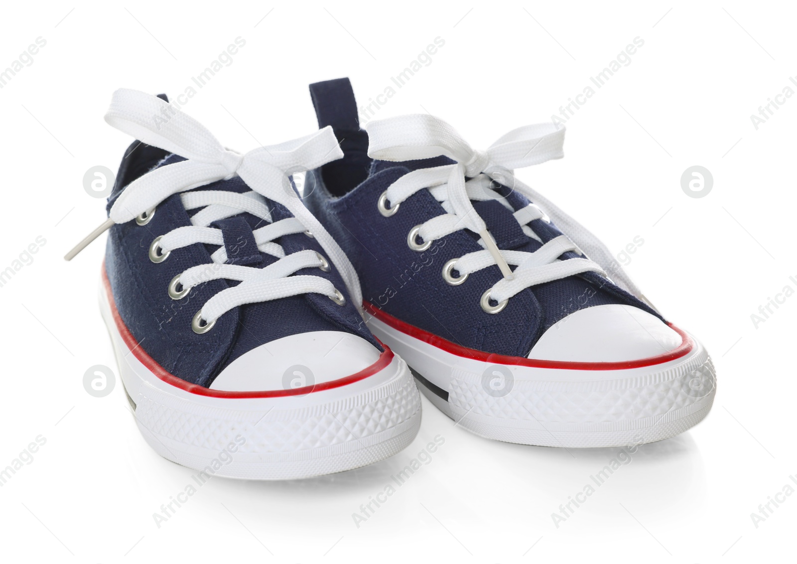 Pair of stylish dark blue sneakers isolated on white Photo of Pair of stylish dark blue sneakers isolated on white