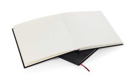 Photo of Two stylish hardcover notebooks isolated on white