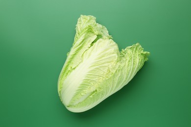 Photo of Fresh Chinese cabbage on green background, top view