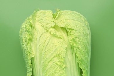 Photo of Fresh Chinese cabbage on green background, top view
