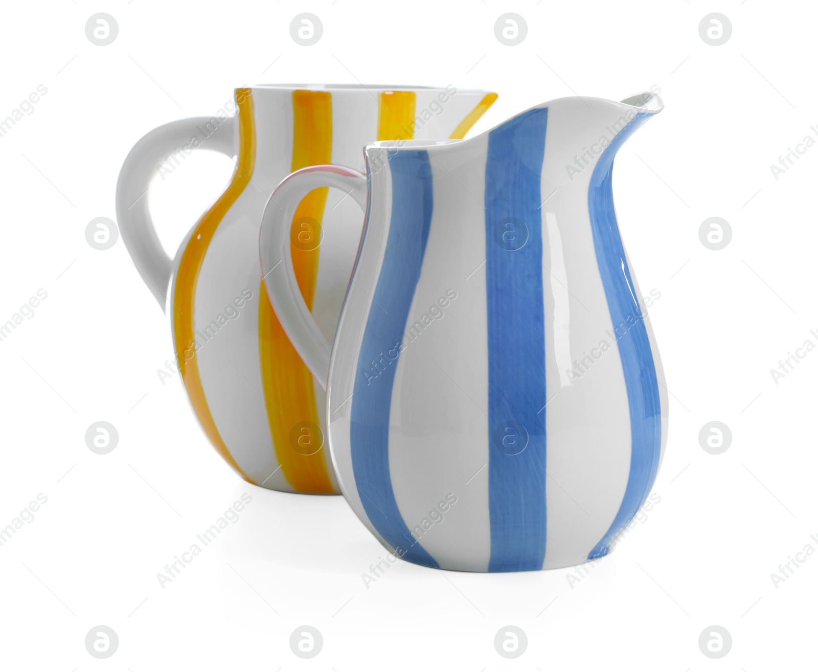 Two striped ceramic jugs isolated on white Photo of Two striped ceramic jugs isolated on white