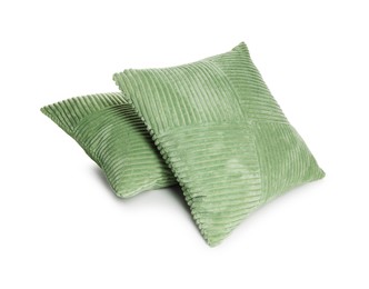 Photo of Two stylish green cushions isolated on white