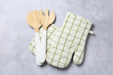 Photo of Different kitchen utensils on light table, flat lay
