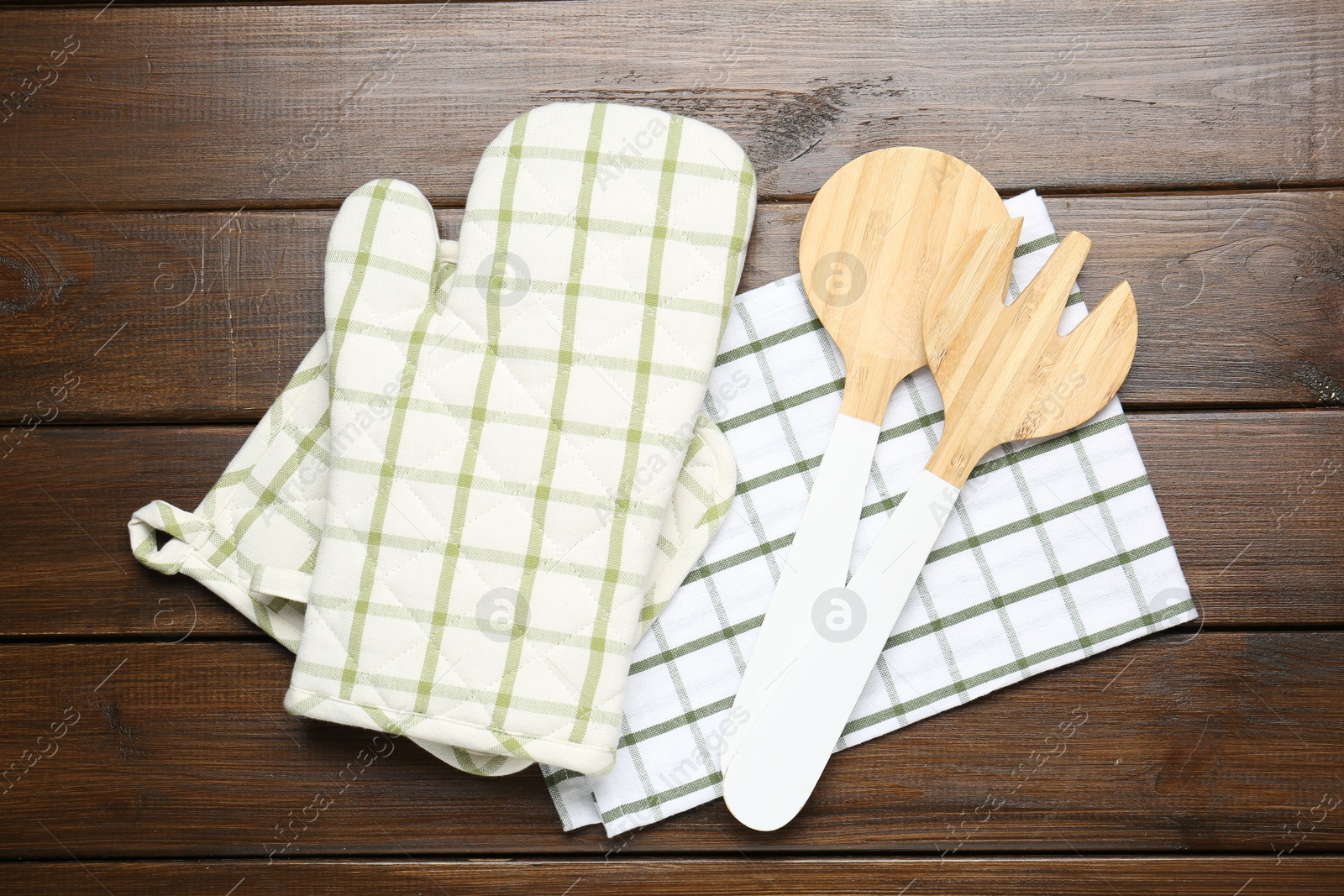 Different kitchen utensils on wooden table, flat lay Photo of Different kitchen utensils on wooden table, flat lay