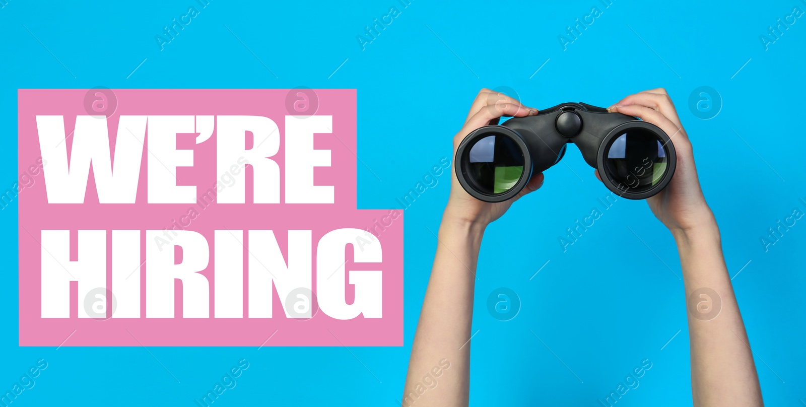 We Are Hiring. Woman with binoculars on light blue background, closeup. Recruitment, human resources concept Image of We Are Hiring. Woman with binoculars on light blue background, closeup. Recruitment, human resources concept