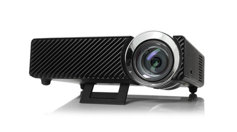 Photo of One modern video projector isolated on white