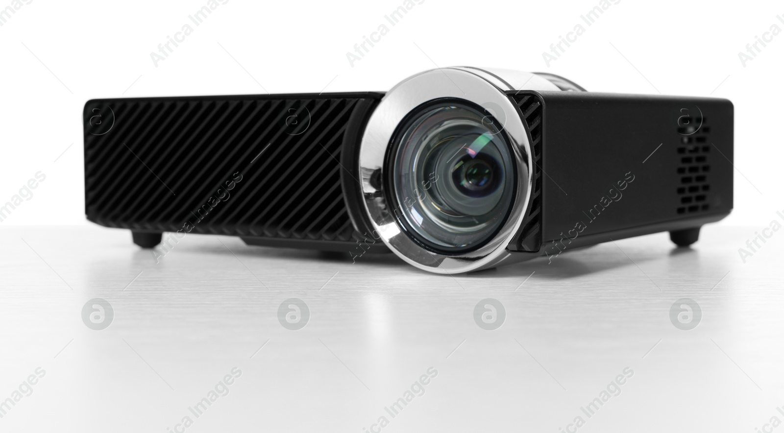 One modern video projector isolated on white Photo of One modern video projector isolated on white