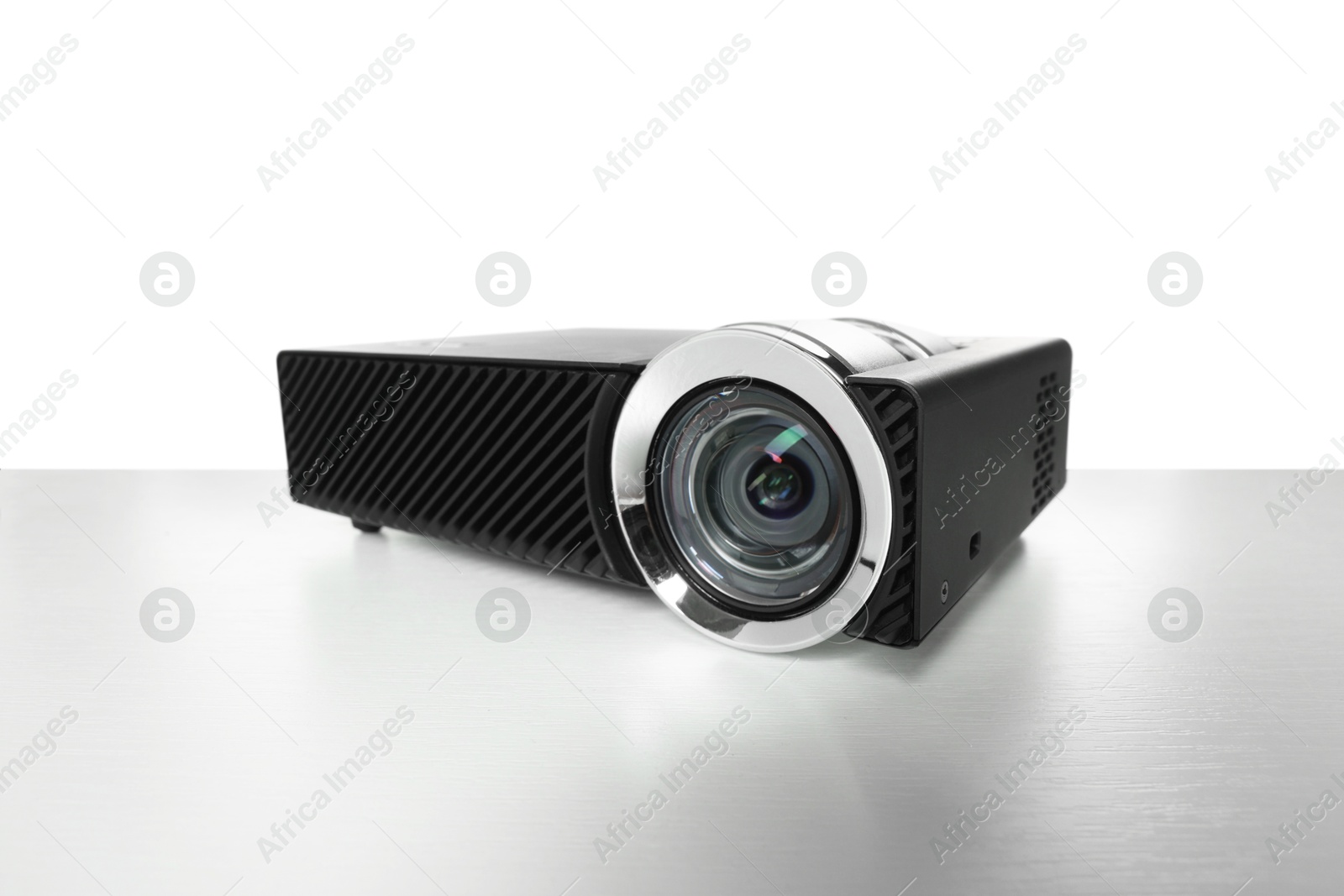 One modern video projector isolated on white Photo of One modern video projector isolated on white