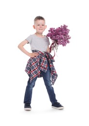 Photo of Little boy with bouquet of lilac flowers on white background