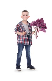 Photo of Little boy with bouquet of lilac flowers on white background