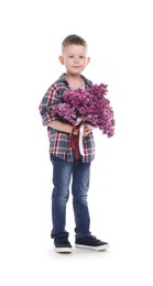 Photo of Little boy with bouquet of lilac flowers on white background