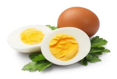 Photo of Boiled eggs and parsley on white background