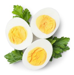 Photo of Boiled eggs and parsley on white background, top view